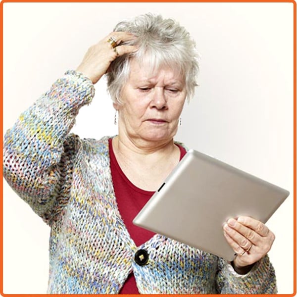 Older adult puzzled by iPad