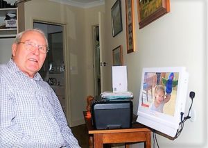 Grand daughter helping to improve memory for her grandfather, using a videophone, from Konnekt Videophone