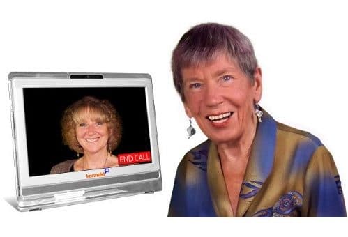 wo smiling faces of a grandma and daughter using videophone communication, one of the best ways on how to improve memory.