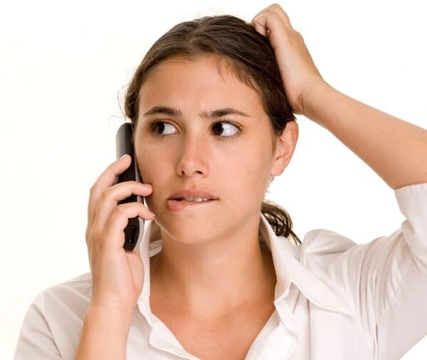 Confused lady on a landline phone
