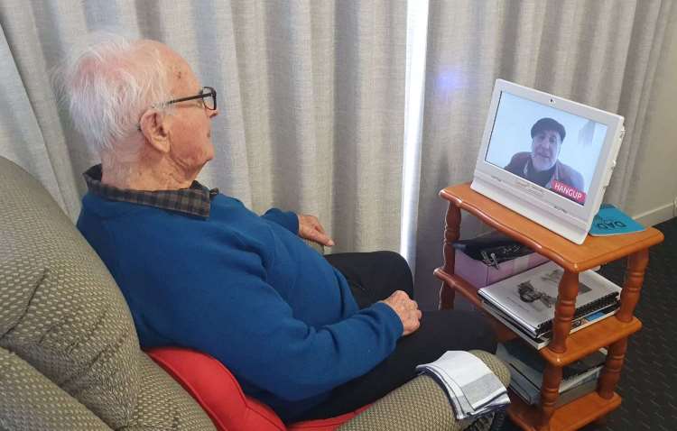 Dad during international video call - side view - S