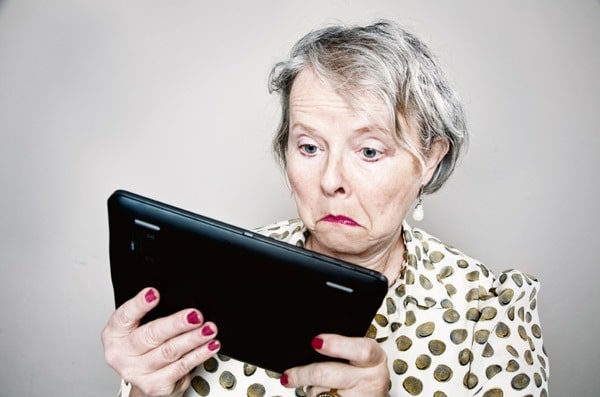 Senior woman confused by tablet